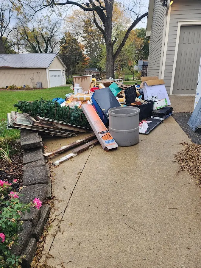 Dumpster being loaded with debris for 3 Yard Dumpster Rental in Baldwinsville